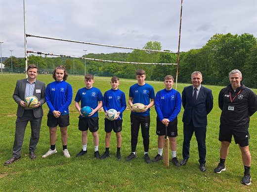 Cllr Anthony Hunt is pictured with Mr Phil Collins, Headteacher at Abersychan and pupils from a year 11 PE lesson