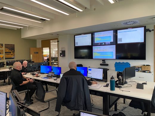 Officers working from a command room
