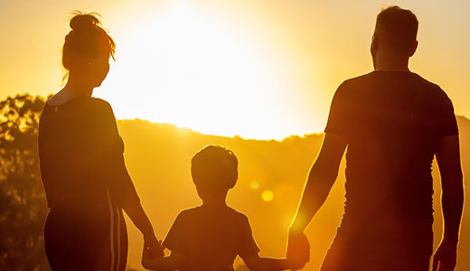 Family watching the sunset