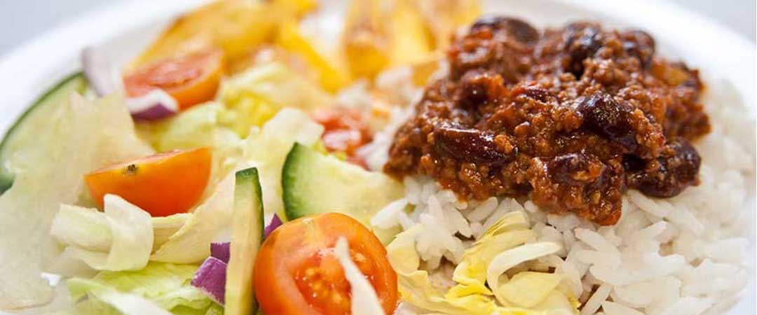 Chilli Con Carne served with rice and peas, sweetcorn and broccoli