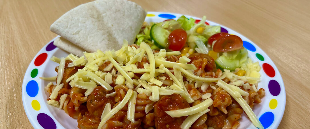 Vegetarian sausage with a savoury tomato sauce