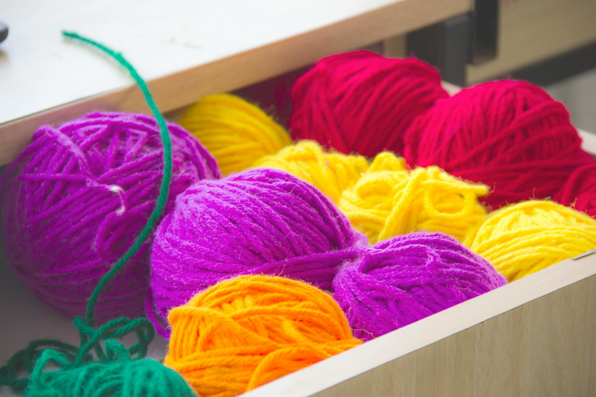 Close up view of coloured wool in a drawer (Pexels - Avni-jain)