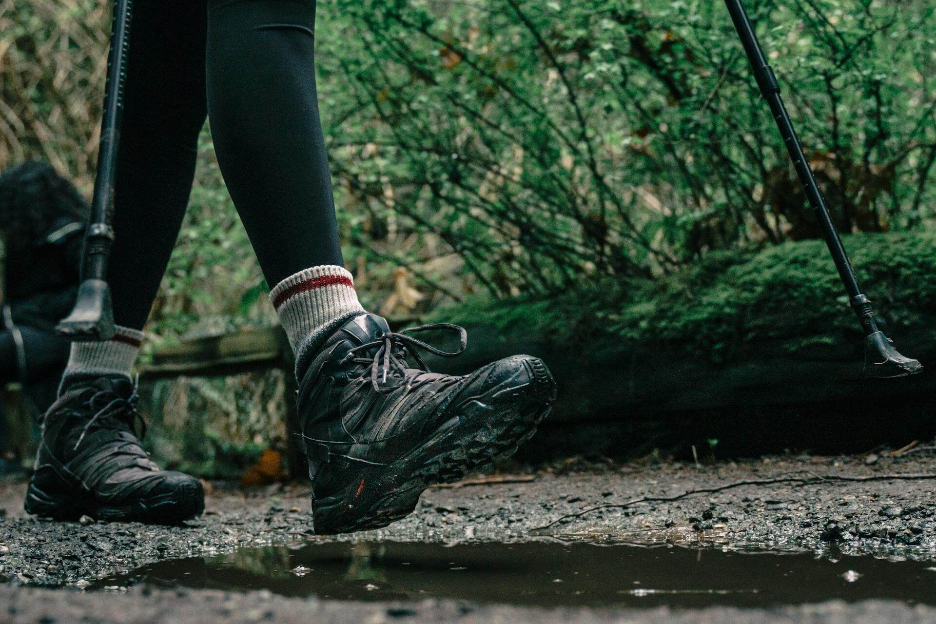 Low angle shot of a person wearing hiking shoes (Pexels - PNW Production)