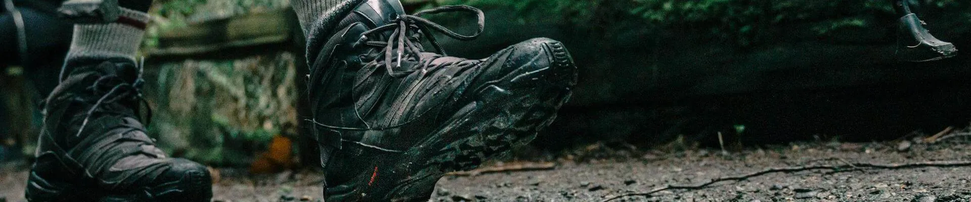 Low angle shot of a person wearing hiking shoes (Pexels - PNW Production)