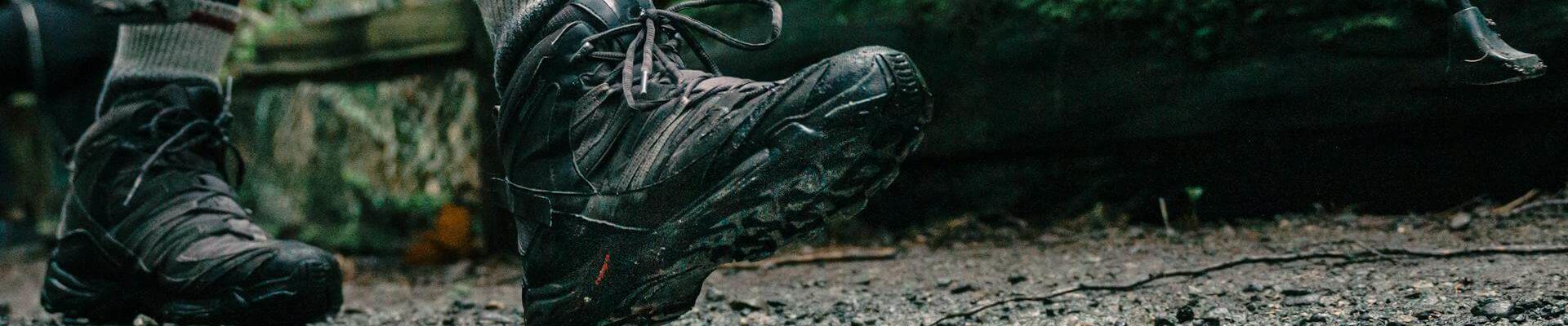 Low angle shot of a person wearing hiking shoes (Pexels - PNW Production)