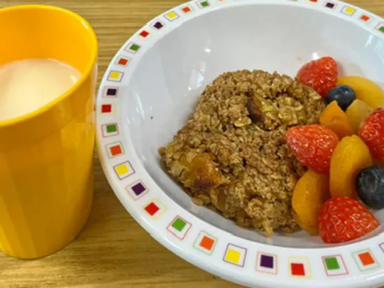 Apricot flapjack, fruit and milk drink