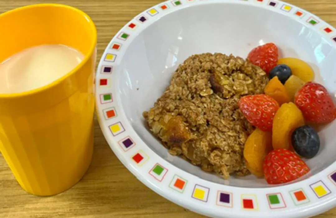 Apricot flapjack, fruit and milk drink