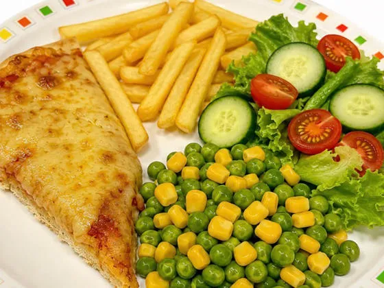 Cheese and tomato pizza with chips, salad, beans or peas and sweetcorn
