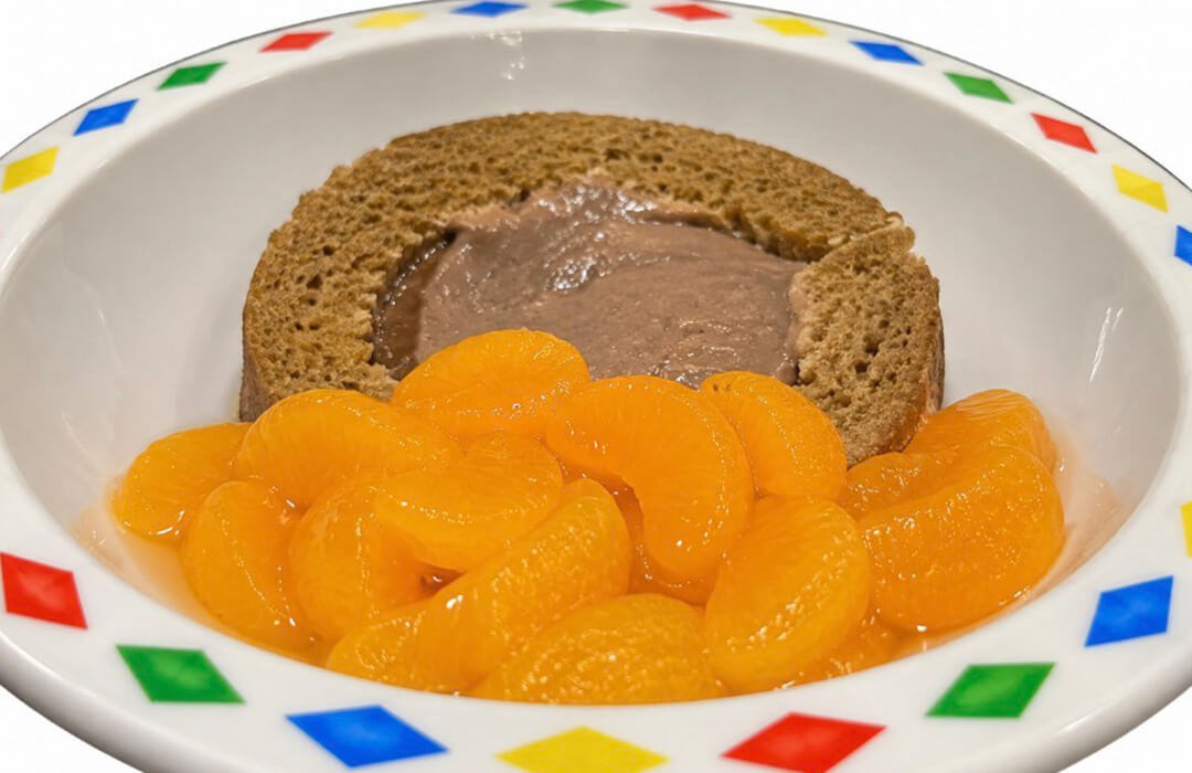 Chocolate arctic roll and mandarins
