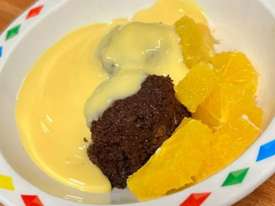 Chocolate orange beet cake with fruit and custard