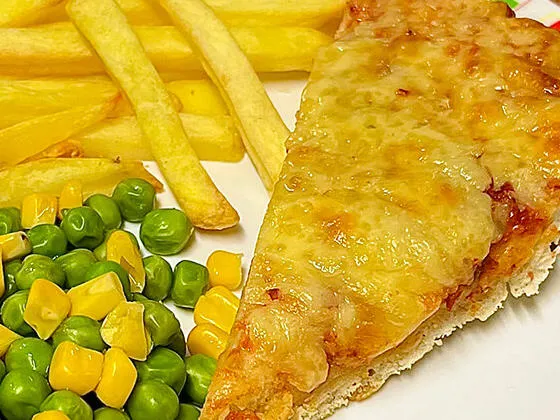 Cheese and tomato pizza served with chips, peas and sweetcorn