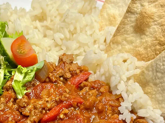 Homemade BBQ Quorn served with rice, tortilla chips and salad