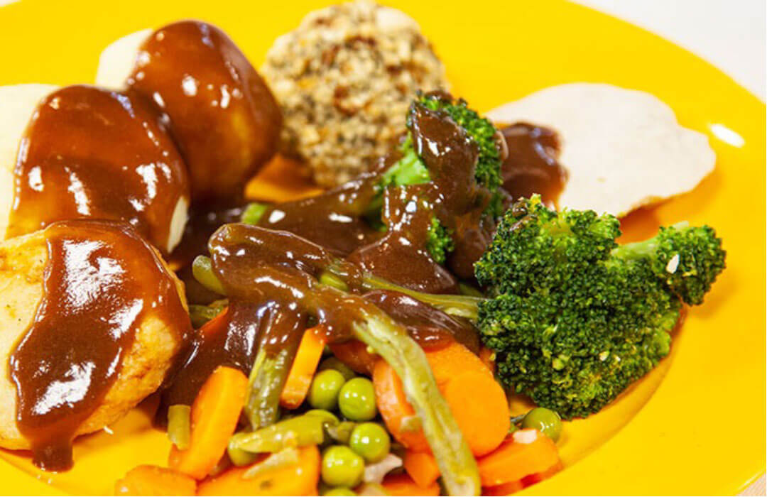 Roast turkey with stuffing with roast and boiled potatoes, vegetables and gravy