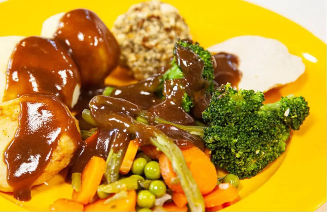 Roast turkey with stuffing with roast and boiled potatoes, vegetables and gravy