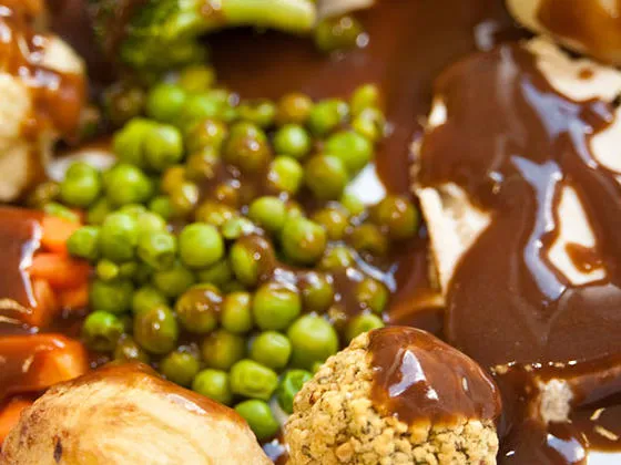 Roast Turkey with Stuffing with Roast and Boiled Potatoes, Vegetables and Gravy
