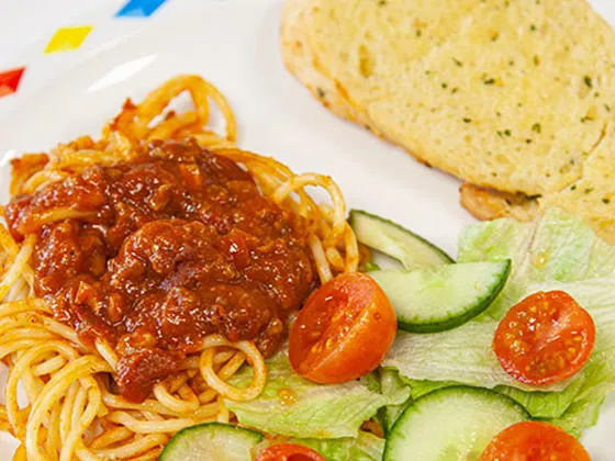 Veggie bolognese with seasonal vegetables and garlic bread