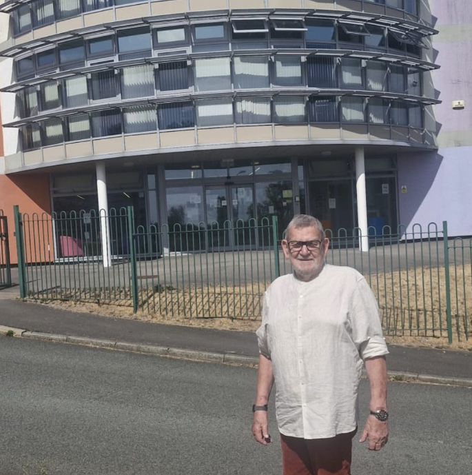 Brian Jones adult learner standing outside the learning centre where he did his gcse  