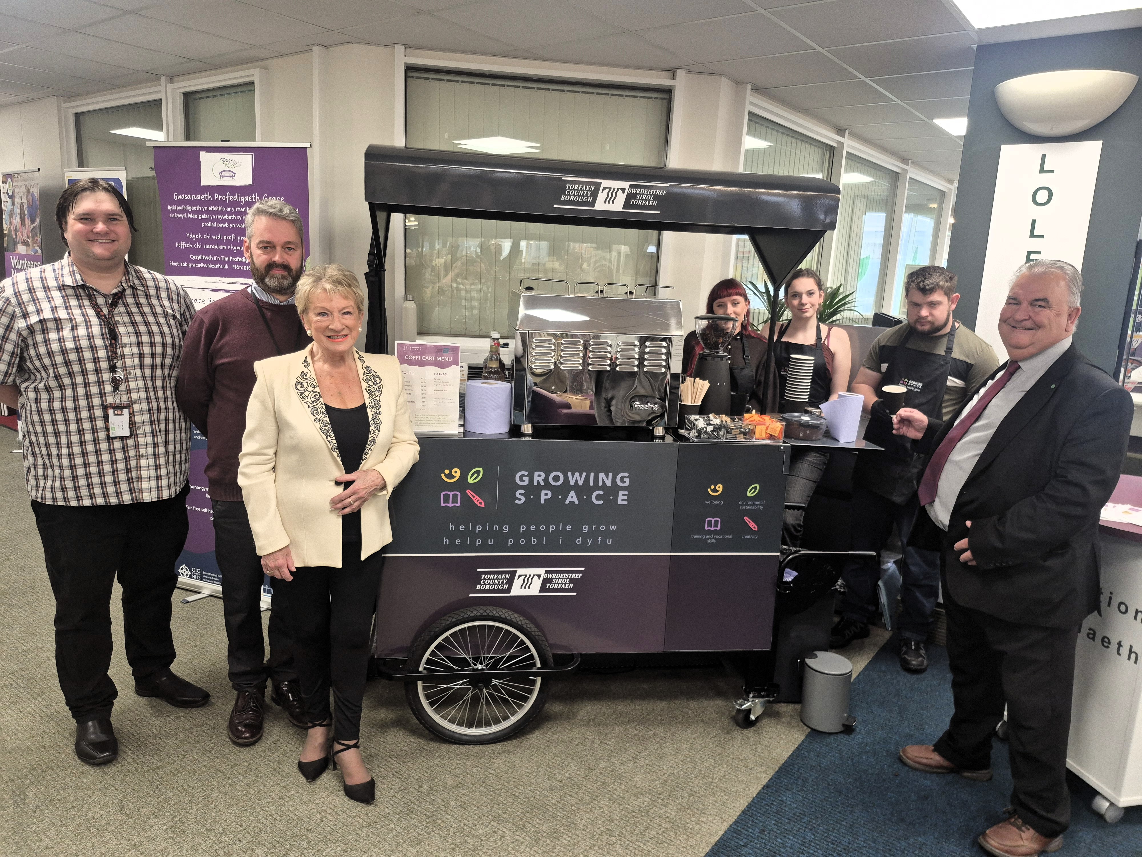 Members of Torfaen Libraries, Growing Space and local councillor in front of the Coffi Cart 