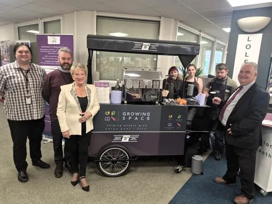 Members of Torfaen Libraries, Growing Space and local councillor in front of the Coffi Cart