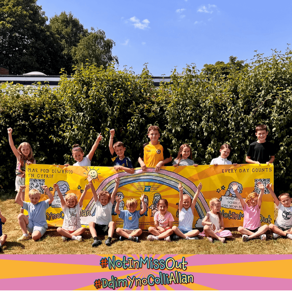 Pupils at Ponthir Church in Wales Primary School holding the #NotInMissOut banner