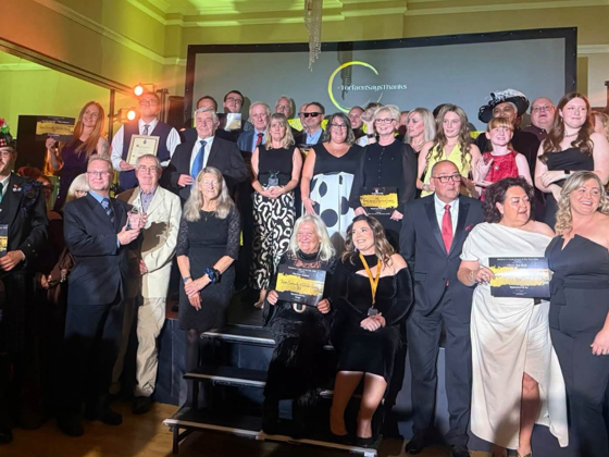 Group photo of volunteers at the awards ceremony