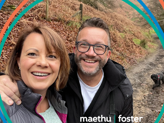 Darren and Emma, two foster carers from Torfaen, out on a walk with their dog